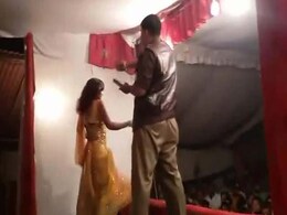Caught on Camera: Policeman Showering Money on Woman Dancing on Stage Caught on Camera: Policeman Showering Money on Woman Dancing on Stage