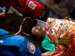 As AirAsia Passengers' Bodies are Found, Grieving Relatives Faint As AirAsia Passengers' Bodies are Found, Grieving Relatives Faint