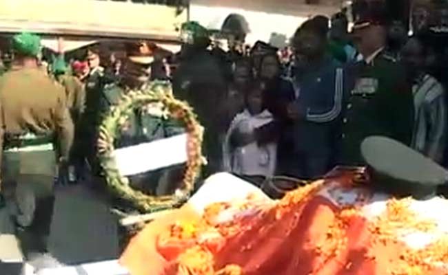 At Martyr's Funeral, an Outpouring of Grief