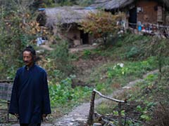 China's Mountain Hermits Seek a Highway to Heaven