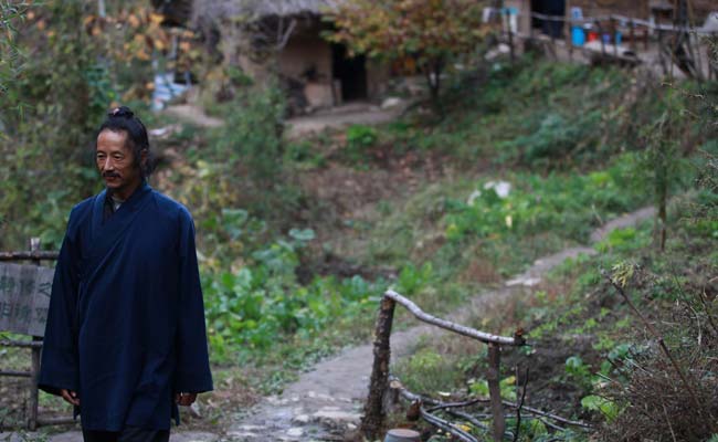 China's Mountain Hermits Seek a Highway to Heaven