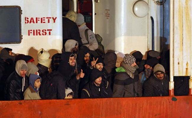 4 Migrants Found Dead on Packed Cargo Ship Brought to Italy