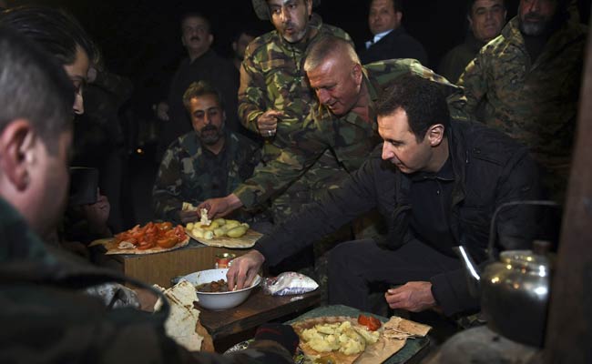 Syria's Assad Shown Hugging Troops in Embattled Damascus District