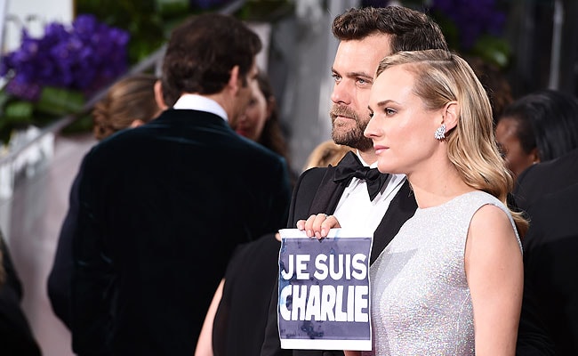 Stars at Golden Globe Awards Support Paris Victims, Free Speech