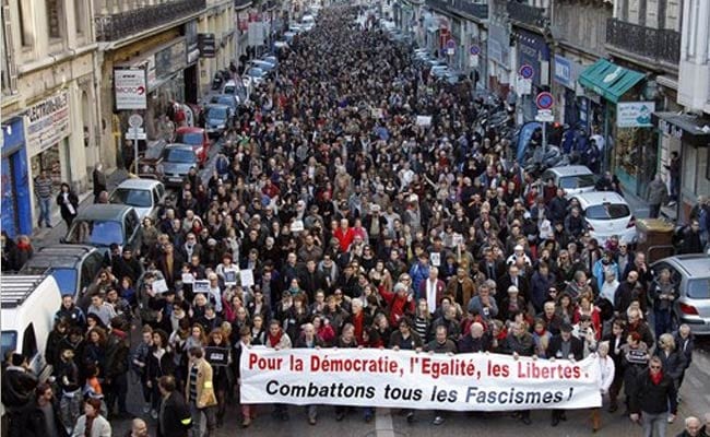 Foreigners Support Their Beloved France on Streets of Paris