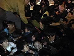 China Sacks 4 Over Shanghai Stampede As Families Compensated