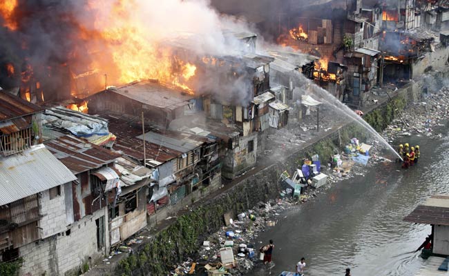 Image result for blazing fire in a slum