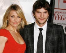 Ashton Kutcher, Cameron Diaz sign scooter for charity