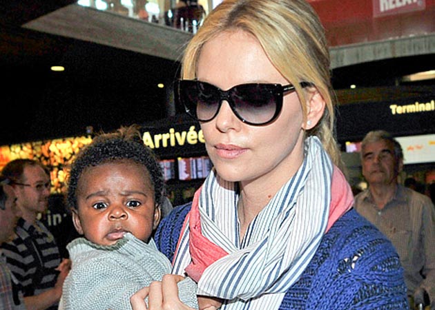 Charlize Theron loves changing diapers