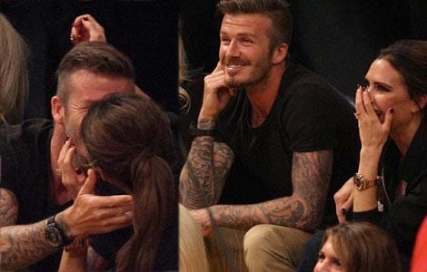 Victoria and David Beckham kiss at basketball game