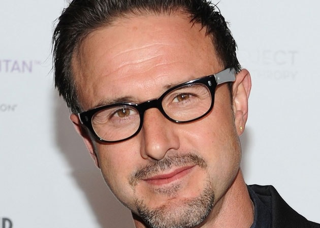 David Arquette decorates night club with naked pictures of his mother