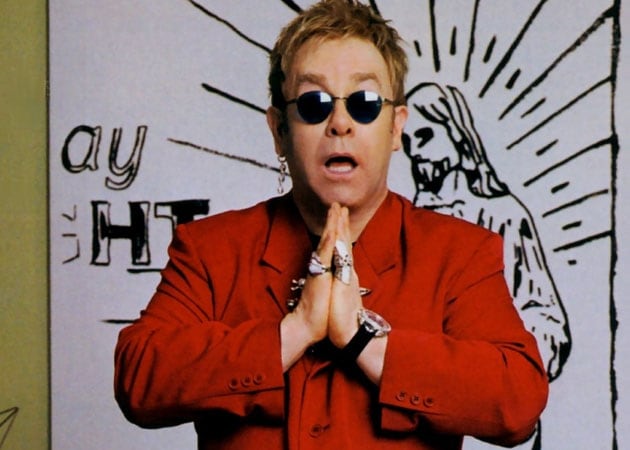 Elton John listens to Dance music in the shower