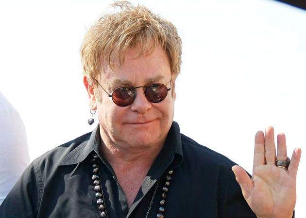 Sir Elton John believes AIDS can be cured "with love"