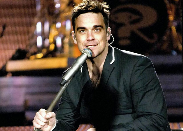 Robbie Williams surprised a fan with a solo performance over an internet video chat 