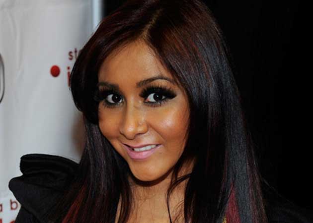 Snooki says her fiance Jionni LaValle takes care of her like a parent