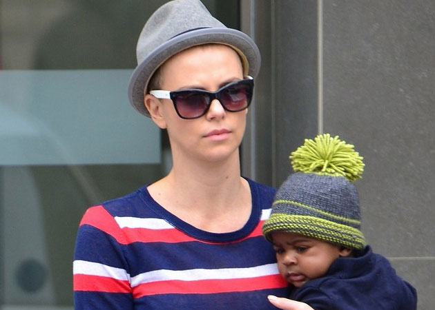 Charlize Theron is desperate for her hair to grow back