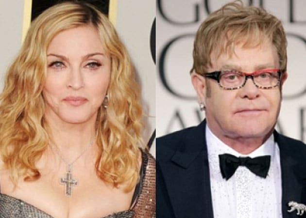 Sir Elton John calls Madonna a "fairground stripper"
