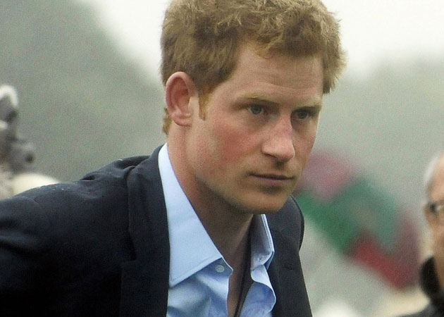 Prince Harry cavorts in pool with bikini-clad girls