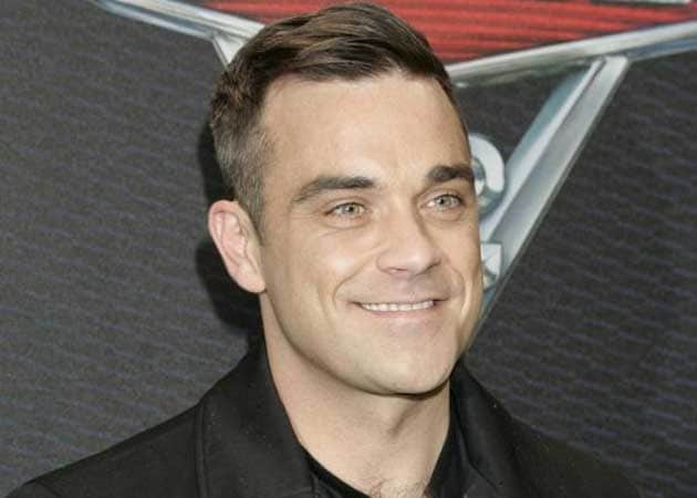 Robbie Williams excited about moving home to the UK