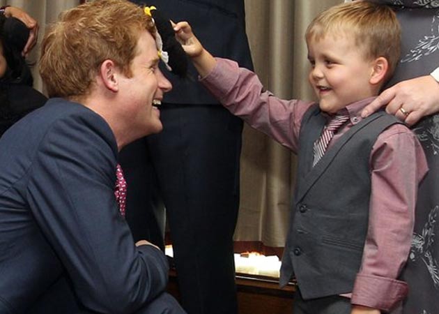 Suit-clad Prince Harry makes first appearance after nude photos