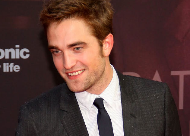 Robert Pattinson is sensitive because he "grew up with lots of girls" 