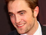 Robert Pattinson is sensitive because he "grew up with lots of girls"