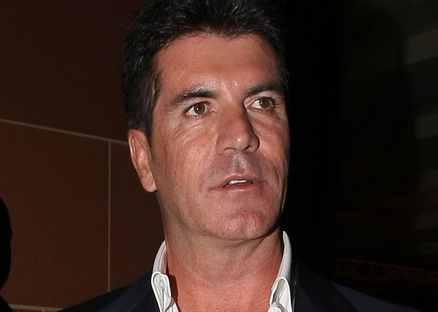 Simon Cowell hid in his closet when an intruder broke into his home