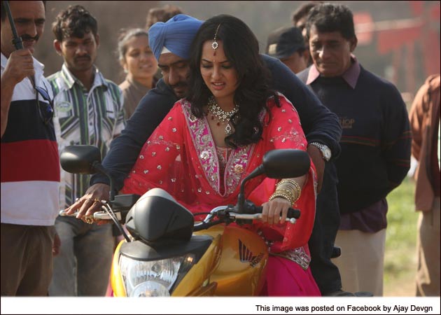 Sonakshi Sinha gets bike riding lesson from Ajay Devgn