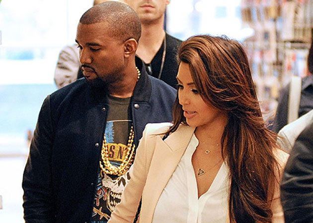Kim Kardashian trying to be "perfect wife" to Kanye West
