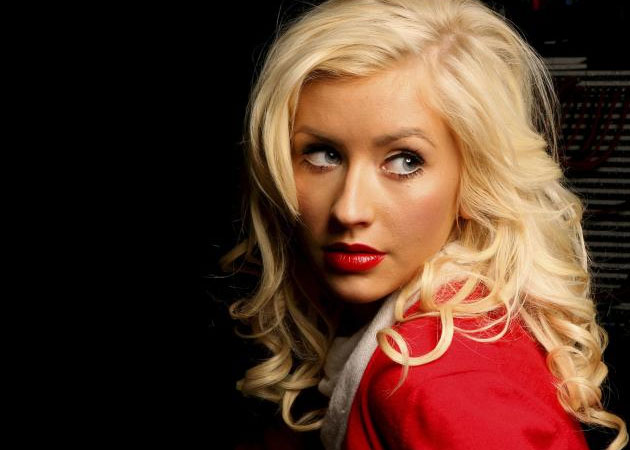 Christina Aguilera hopes her curvy figure will "empower" women