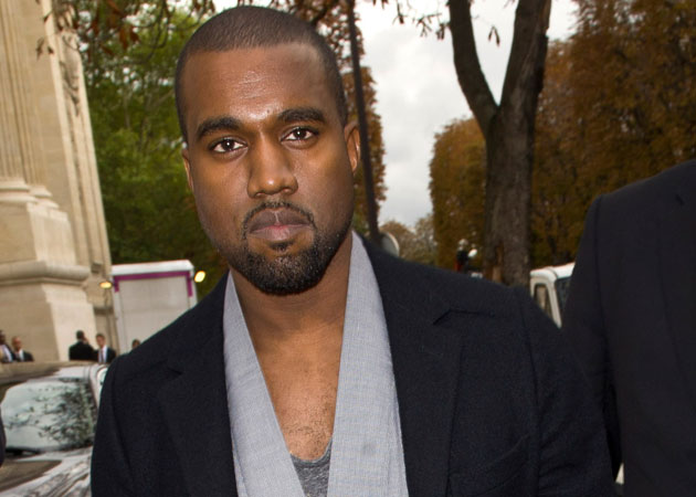 Kanye West tries to snatch paparazzo's camera