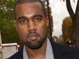 Kanye West tries to snatch paparazzo's camera