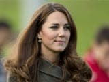 After photo scandal, Kate Middleton covers up for football