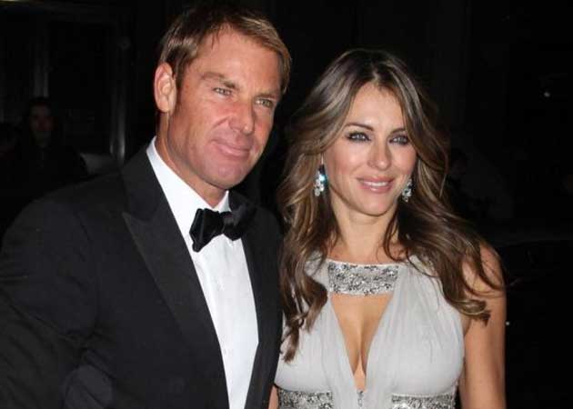 Elizabeth Hurley, Shane Warne kiss on golf course