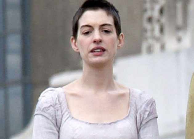 Anne Hathaway's short hair makes her look like her "gay brother"