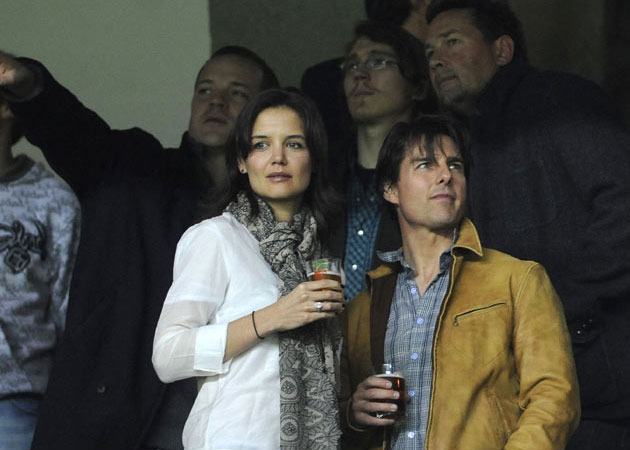 Katie Holmes still "trapped" by Tom Cruise?