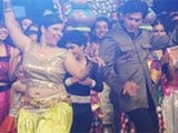 Shah Rukh Khan kisses belly-dancer on <i>India's Got Talent</i>