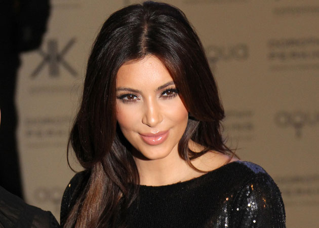 Kim Kardashian is "desperate" to stay in shape during her pregnancy