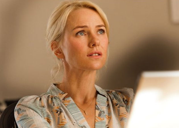 Naomi Watts says her family life is "not all a bed of roses"