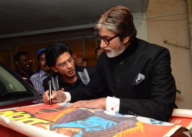 Amitabh Bachchan signs film poster for famous fan Shah Rukh Khan