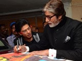 Amitabh Bachchan signs film poster for famous fan Shah Rukh Khan