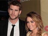 Miley Cyrus wears engagement ring, denies calling off wedding