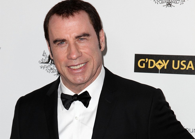 John Travolta gatecrashes wedding in T-shirt, baseball cap