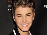 Justin Bieber laughs away staircase tumble