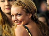 Smiling Lindsay Lohan leaves rehab