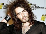 Russell Brand turns yoga teacher