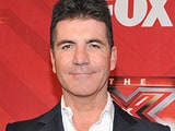 Simon Cowell "happy and excited" to become a father