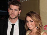 Move over Miley Cyrus, Liam Hemsworth caught kissing new girl