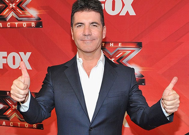 Simon Cowell describes seeing baby scan as 'surreal'