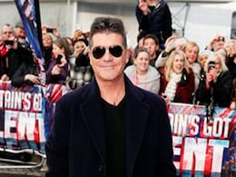 Simon Cowell calls unborn baby Tad Simon Cowell calls unborn baby Tad